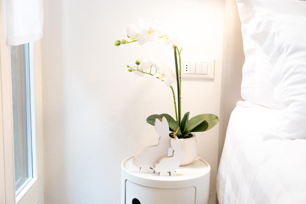 A bed or beds in a room at San Marco Design Suites
