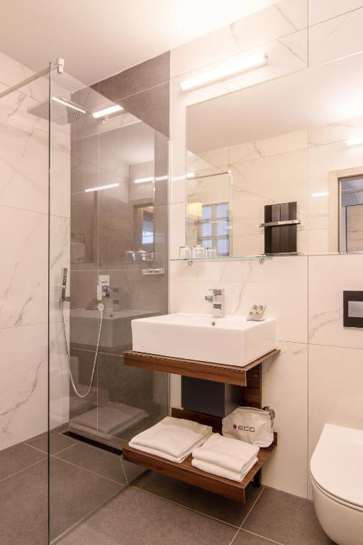 a bathroom with a sink and a shower at Dependences - San Simon Resort in Izola