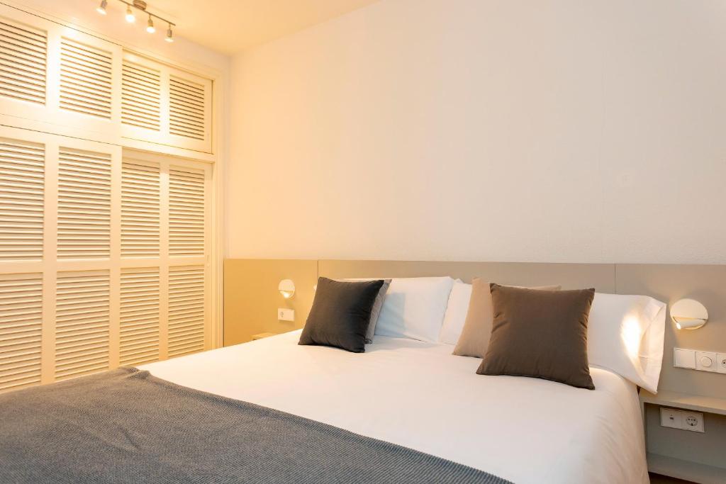 Postel nebo postele na pokoji v ubytování Ses Eufabietes Apartments & Restaurant