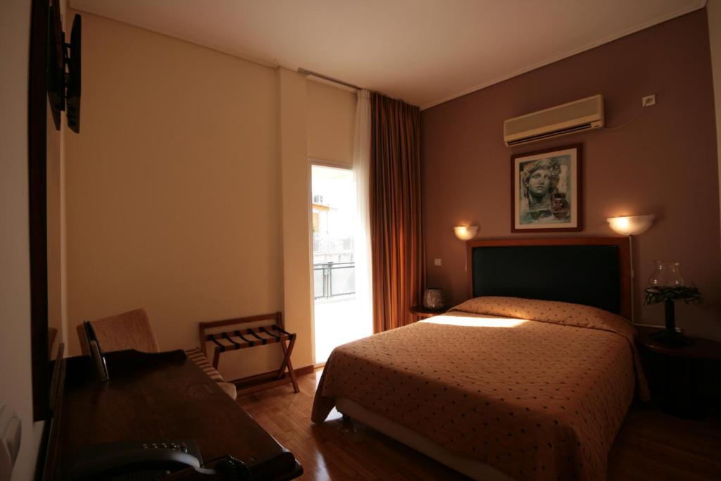 Postel nebo postele na pokoji v ubytování Adams Hotel