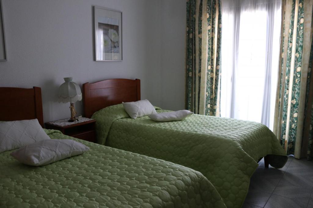 Postel nebo postele na pokoji v ubytování Casa Belmira