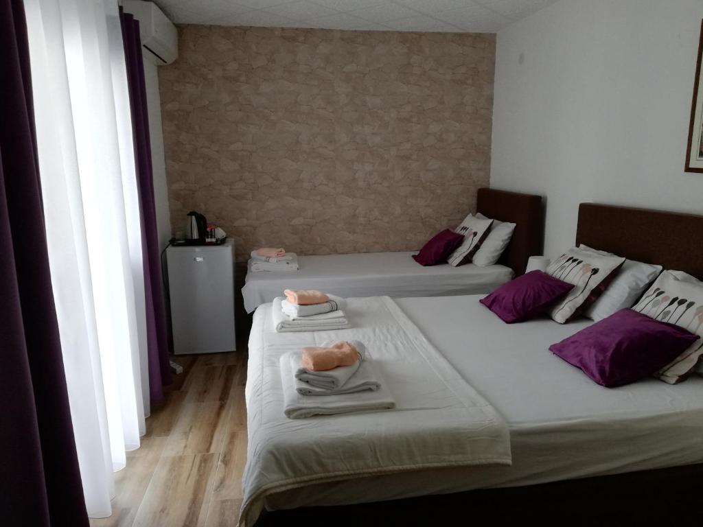 Postel nebo postele na pokoji v ubytování Apartments Zec