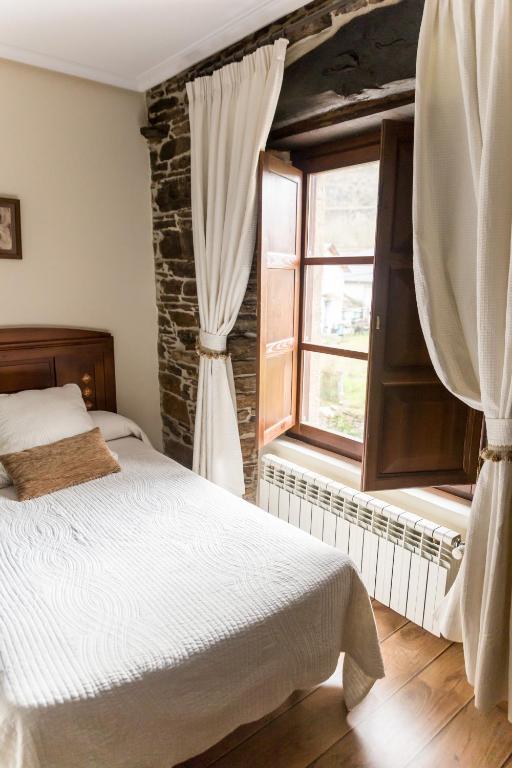 Postel nebo postele na pokoji v ubytování Hotel Ambasmestas