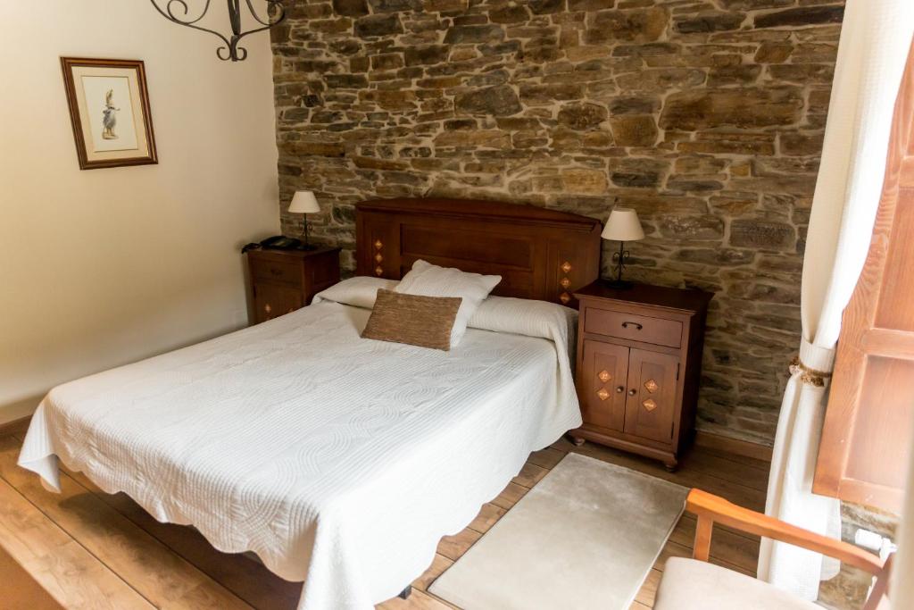 Postel nebo postele na pokoji v ubytování Hotel Ambasmestas