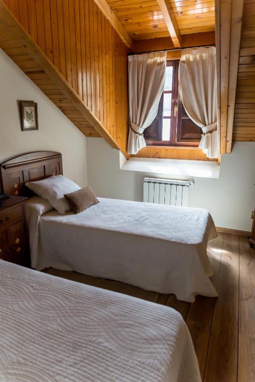 Postel nebo postele na pokoji v ubytování Hotel Ambasmestas