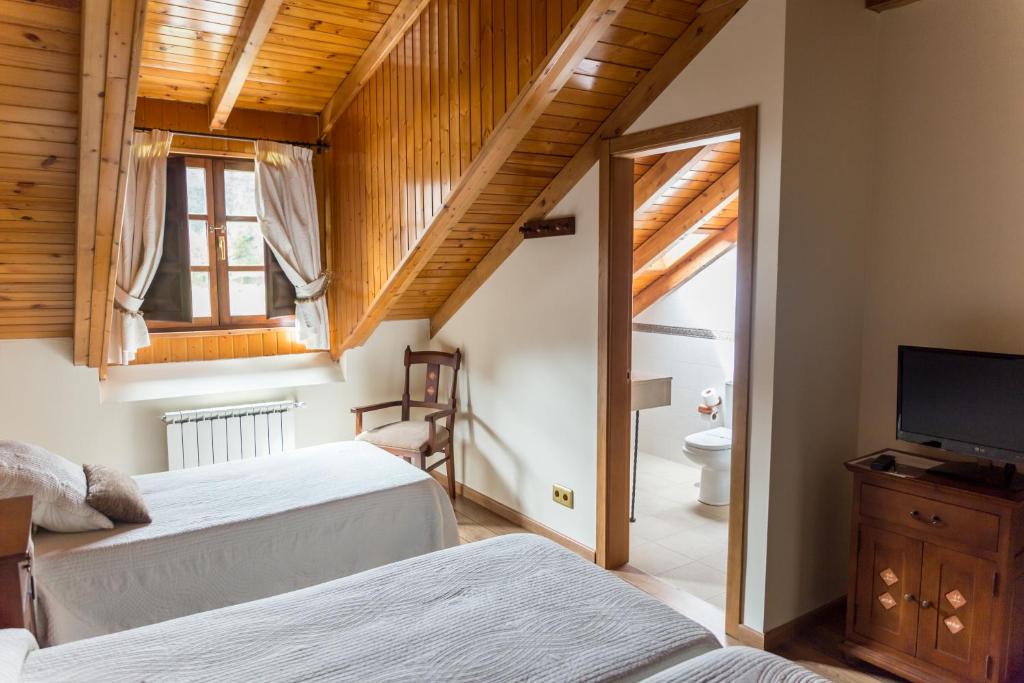 Postel nebo postele na pokoji v ubytování Hotel Ambasmestas