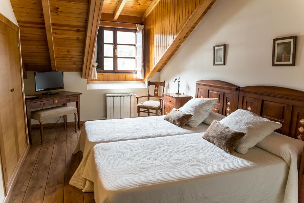 Postel nebo postele na pokoji v ubytování Hotel Ambasmestas