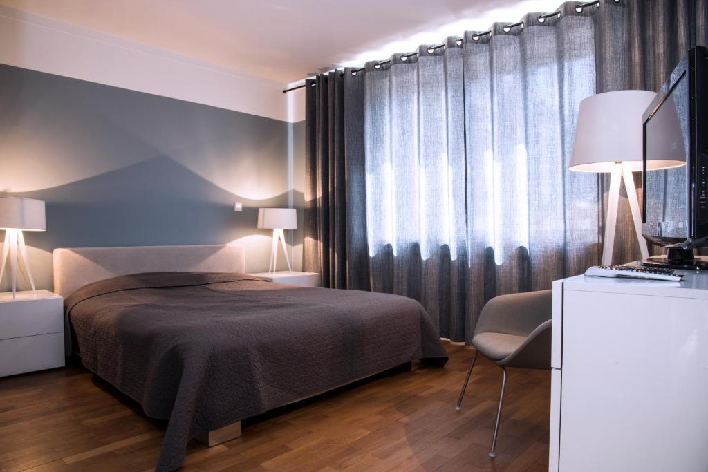 Rúm í herbergi á Residence Key Inn - Limperstberg