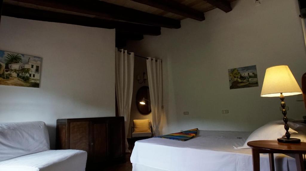 Postel nebo postele na pokoji v ubytování Agroturismo Can Torna AG178
