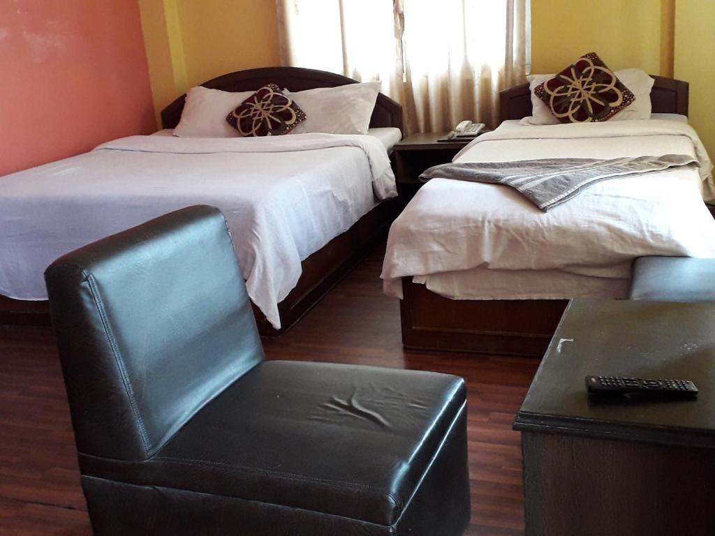 Postel nebo postele na pokoji v ubytování Hotel Vision