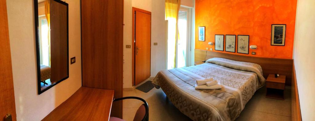 Postel nebo postele na pokoji v ubytování Hotel Amoha