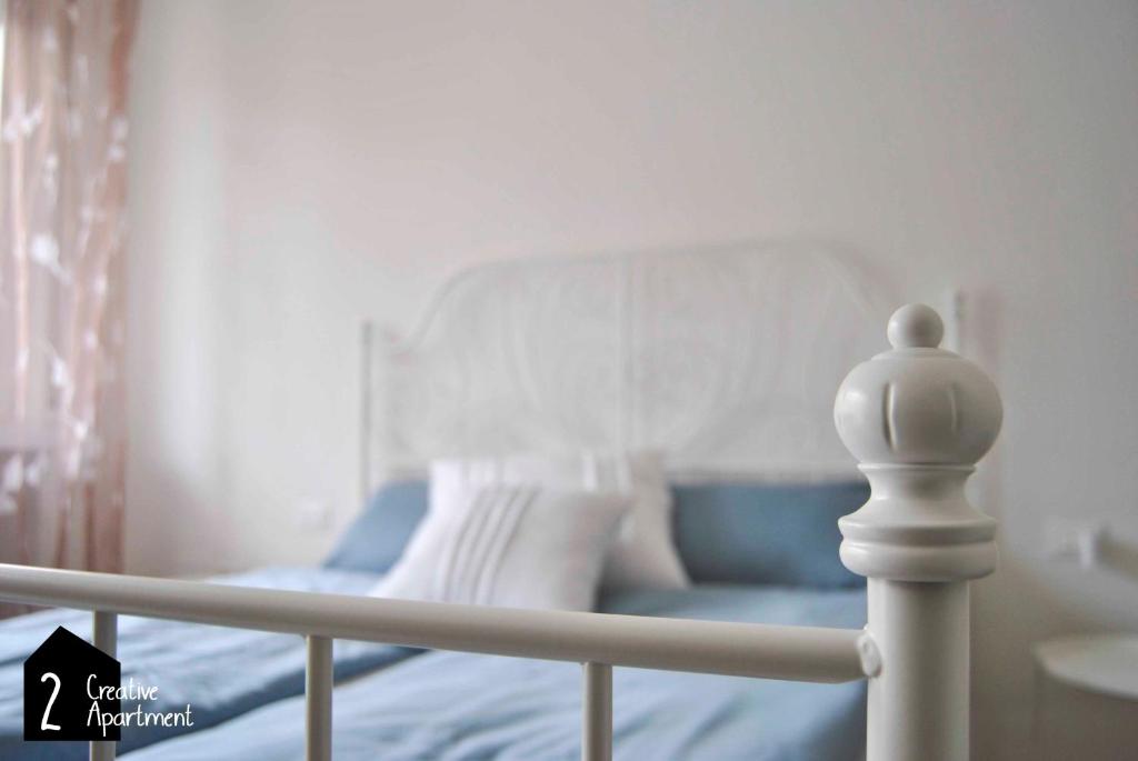 Postel nebo postele na pokoji v ubytování Creative Apartment