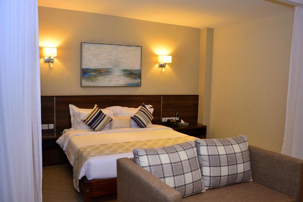 Postel nebo postele na pokoji v ubytování Razana Hotel