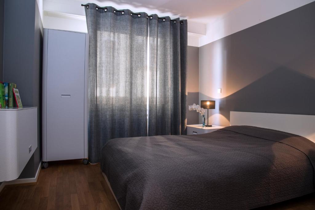Rúm í herbergi á Residence Key Inn - Limperstberg