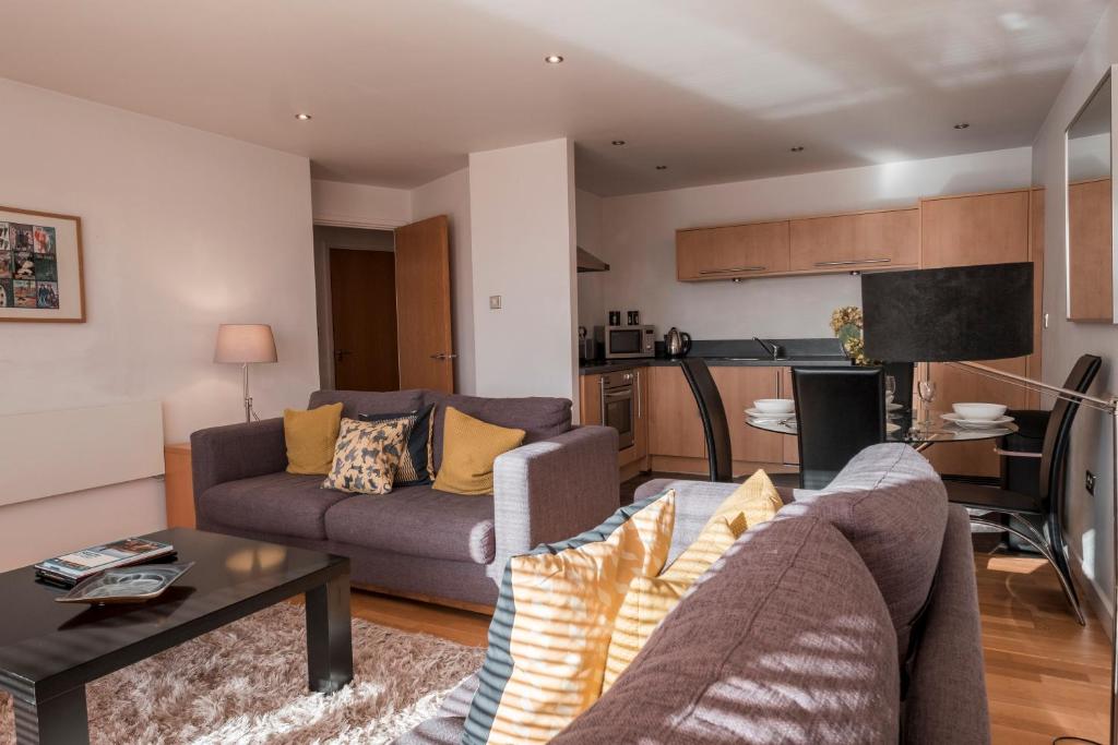 a living room with a couch and a table at The Chambers, Riverside West in Leeds