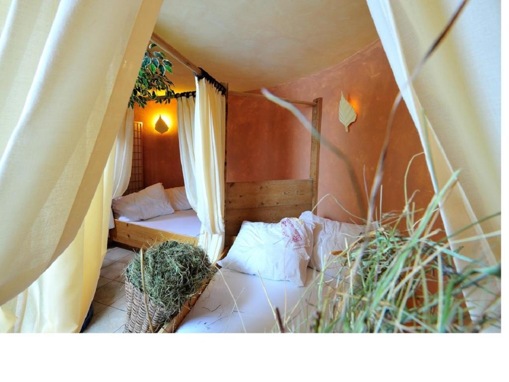 Postel nebo postele na pokoji v ubytování Hotel Tannenhof