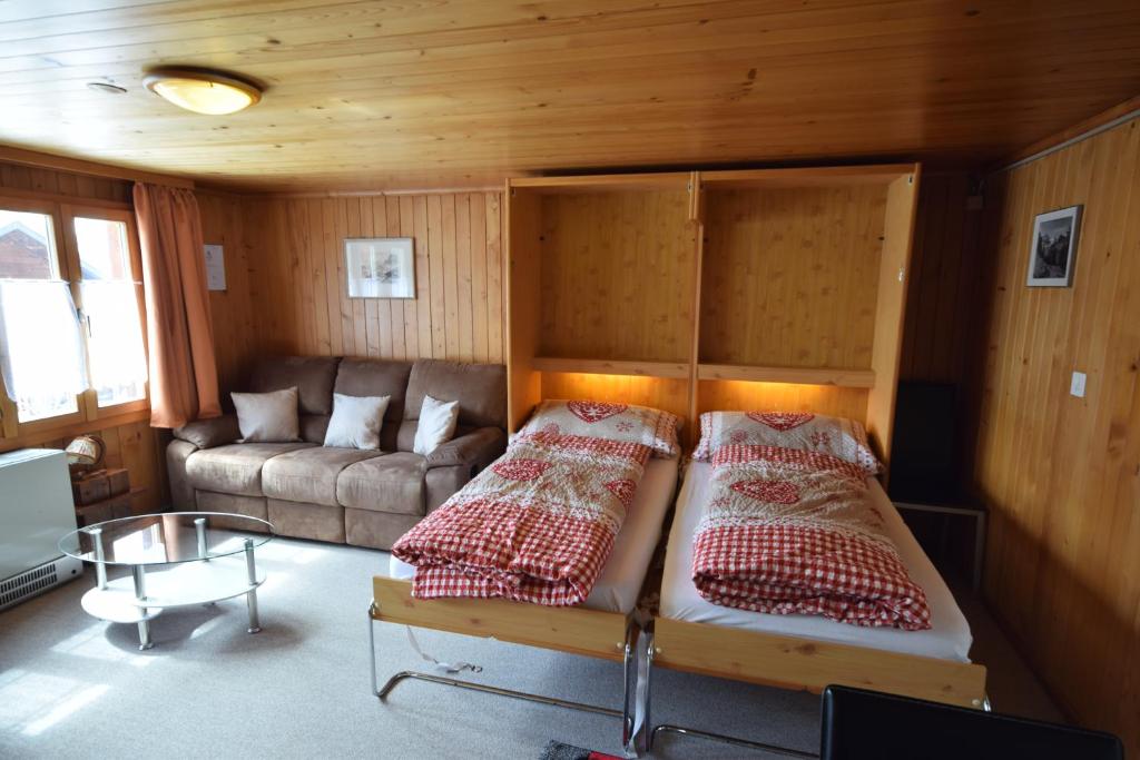 Uma cama ou camas num quarto em Chalet Bim Chilchli