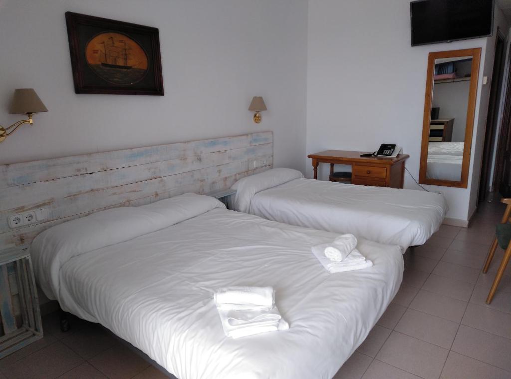 Postel nebo postele na pokoji v ubytování Hotel Corisco