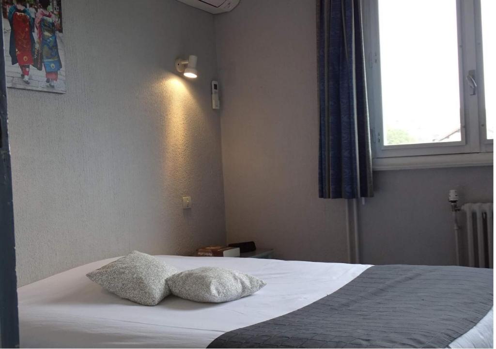 Postel nebo postele na pokoji v ubytování Europa Hotel