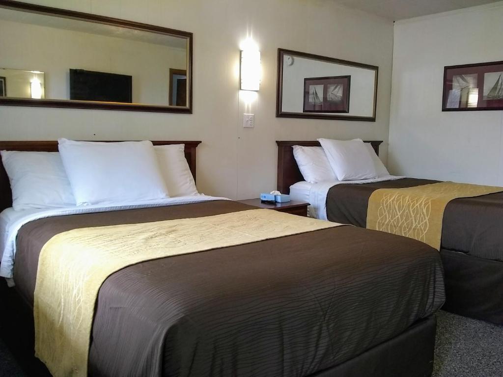 En eller flere senger på et rom på Green Valley Motel Williamstown