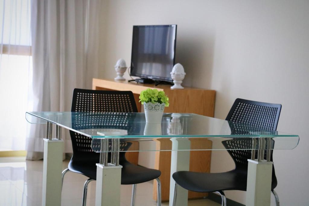 TV a/nebo společenská místnost v ubytování Hotel Suites Bernini