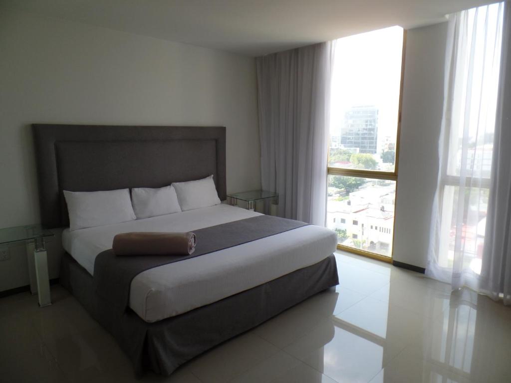 Postel nebo postele na pokoji v ubytování Hotel Suites Bernini