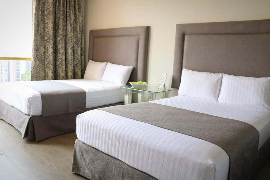 Postel nebo postele na pokoji v ubytování Hotel Suites Bernini