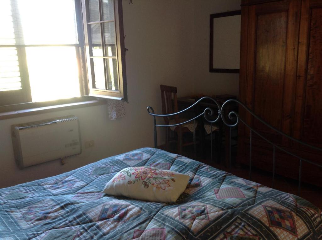 Postel nebo postele na pokoji v ubytování Bio Agriturismo Il Cavone