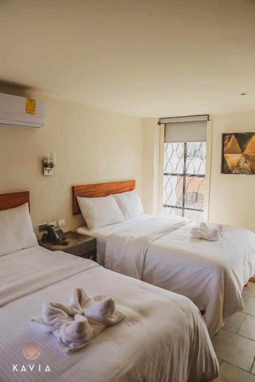 Postel nebo postele na pokoji v ubytování Hotel Urban