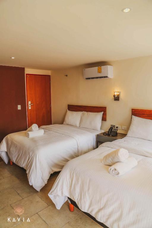 Postel nebo postele na pokoji v ubytování Hotel Urban