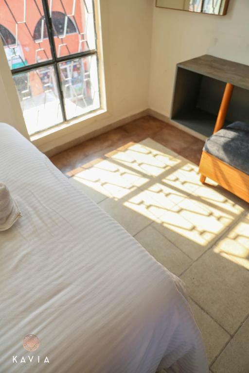 Postel nebo postele na pokoji v ubytování Hotel Urban