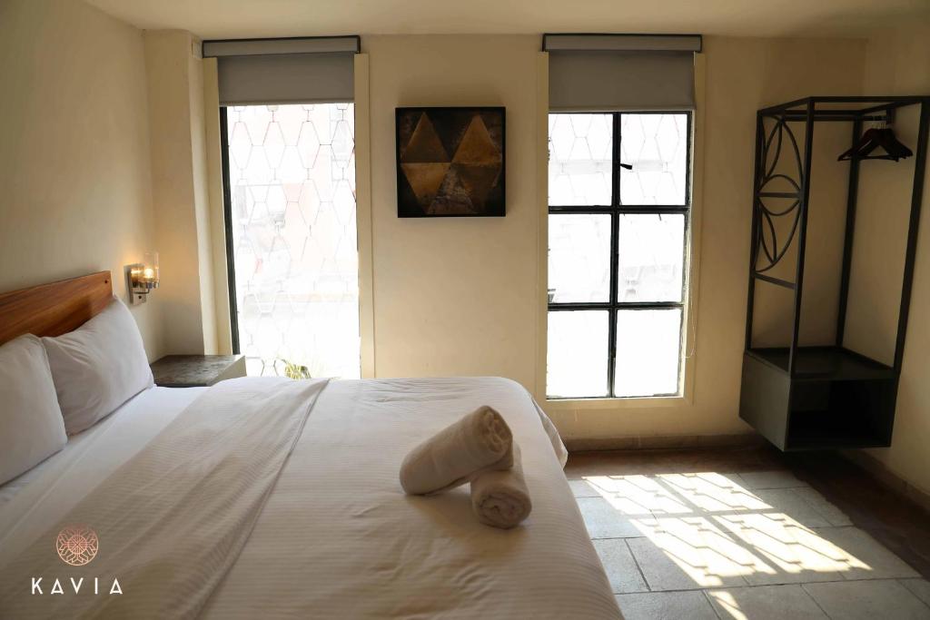 Postel nebo postele na pokoji v ubytování Hotel Urban