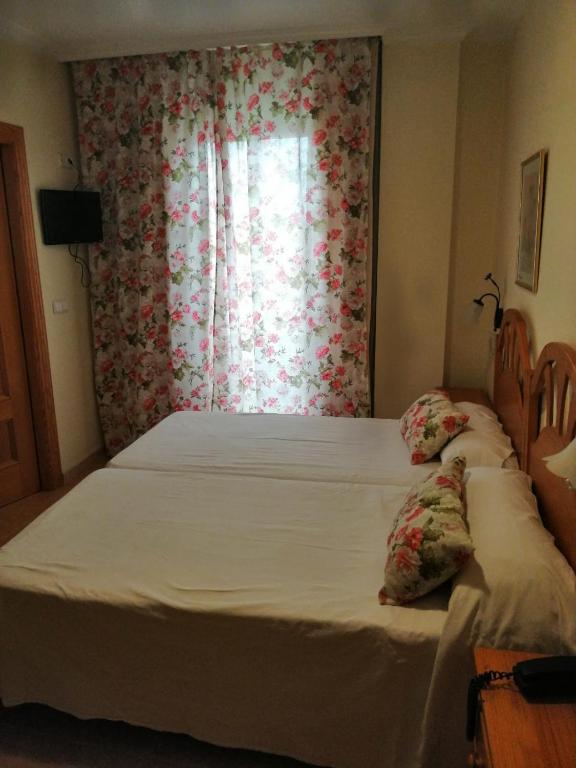 Postel nebo postele na pokoji v ubytování Hotel Paloma