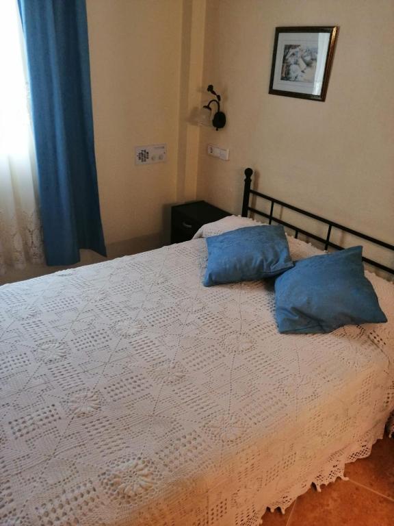 Postel nebo postele na pokoji v ubytování Hotel Paloma