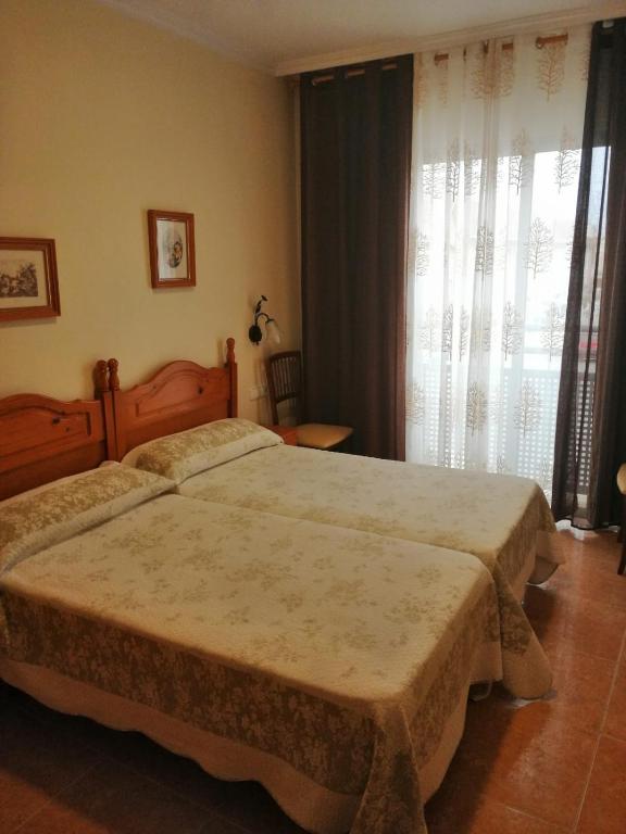 Postel nebo postele na pokoji v ubytování Hotel Paloma
