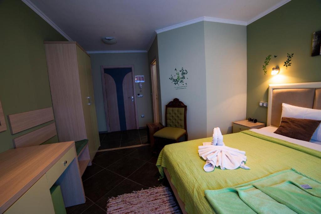 Postel nebo postele na pokoji v ubytování Garni Hotel Lama