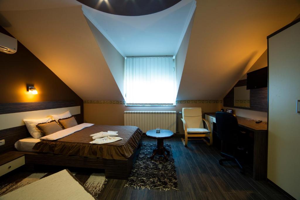Postel nebo postele na pokoji v ubytování Garni Hotel Lama