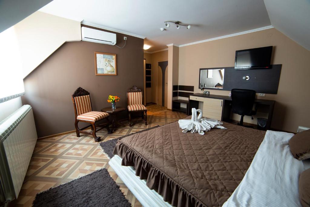 Postel nebo postele na pokoji v ubytování Garni Hotel Lama