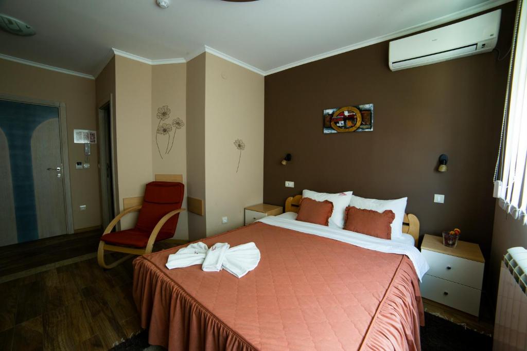 Postel nebo postele na pokoji v ubytování Garni Hotel Lama