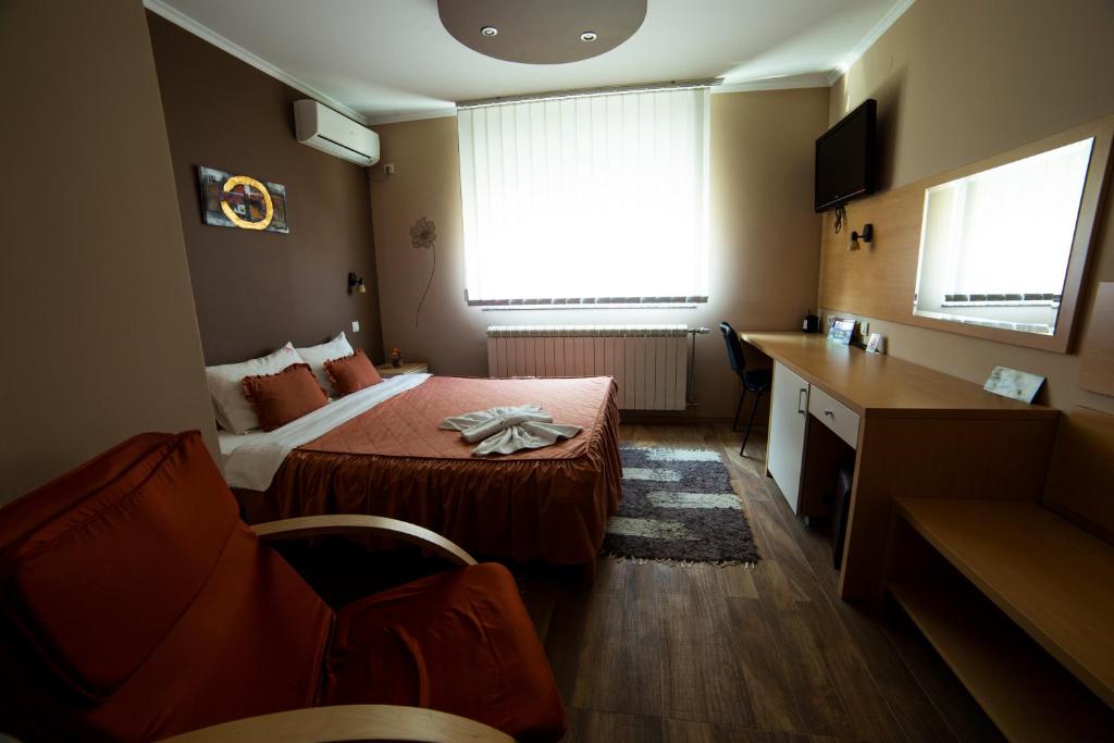Postel nebo postele na pokoji v ubytování Garni Hotel Lama