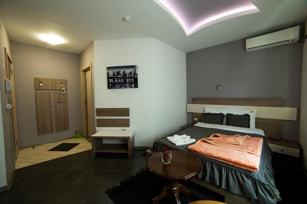 Postel nebo postele na pokoji v ubytování Garni Hotel Lama
