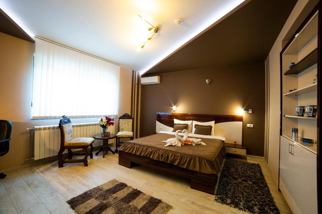 Postel nebo postele na pokoji v ubytování Garni Hotel Lama
