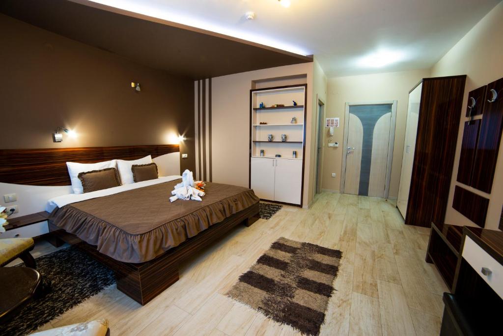 Postel nebo postele na pokoji v ubytování Garni Hotel Lama
