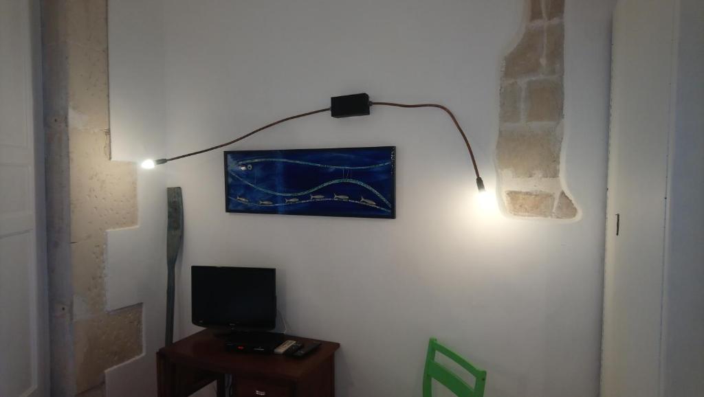 TV a/nebo společenská místnost v ubytování L'Acanto