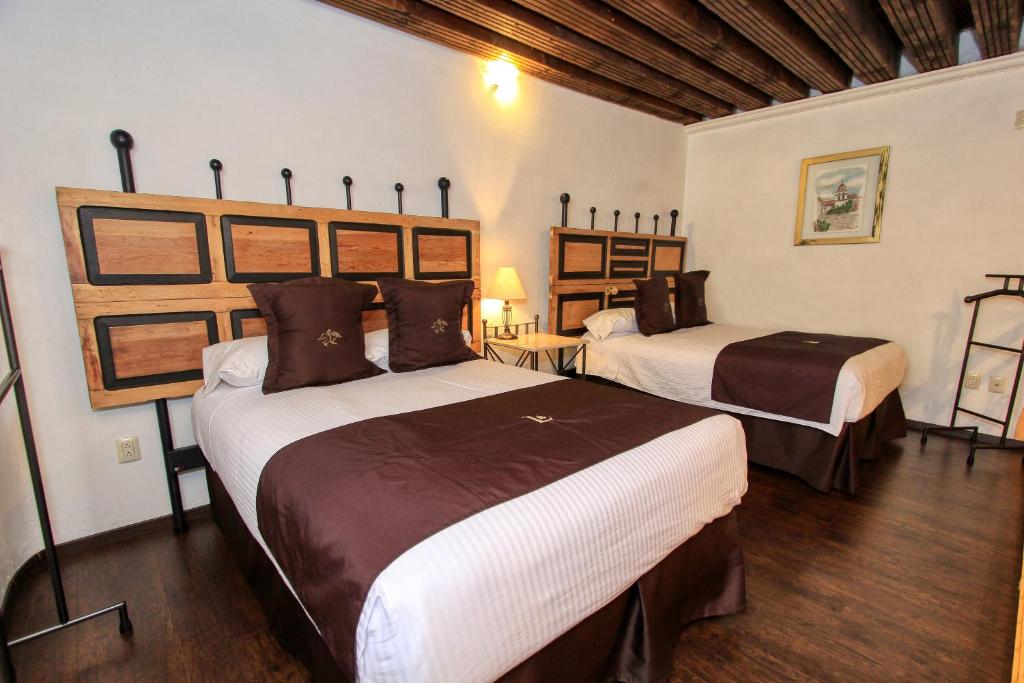 Postel nebo postele na pokoji v ubytování La Casona de Don Lucas