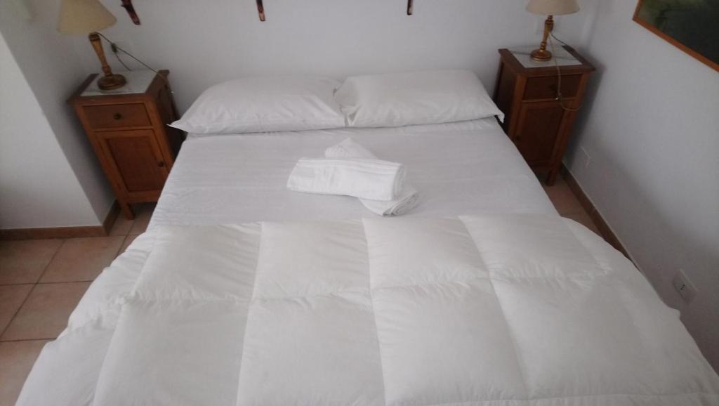 Postel nebo postele na pokoji v ubytování L'Acanto