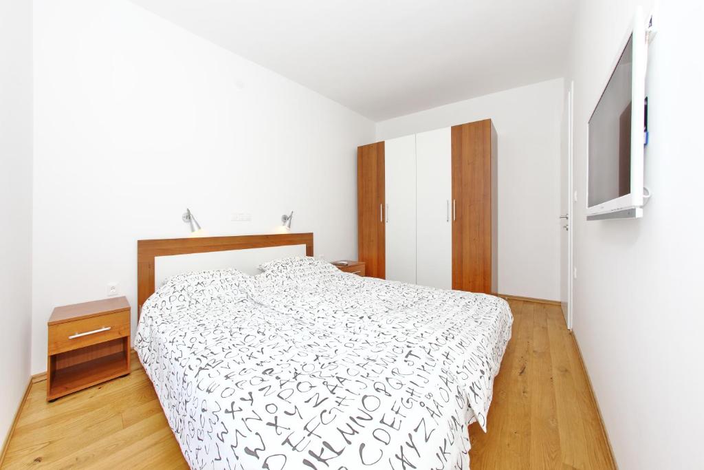Posteľ alebo postele v izbe v ubytovaní Apartments Vila Moli