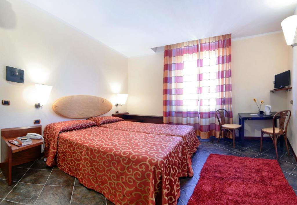 Posteľ alebo postele v izbe v ubytovaní Antico Albergo Madonna