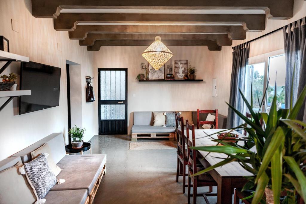 a living room with a couch and a table at Wild House Tarifa in Tarifa