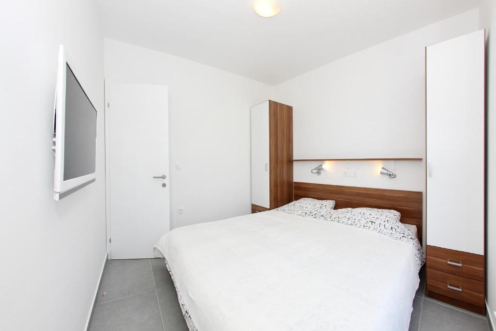 Posteľ alebo postele v izbe v ubytovaní Apartments Vila Moli